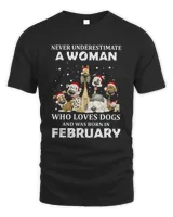 Never Underestimate A Woman Who Loves Dogs And Was Born In February Christmas Shirt